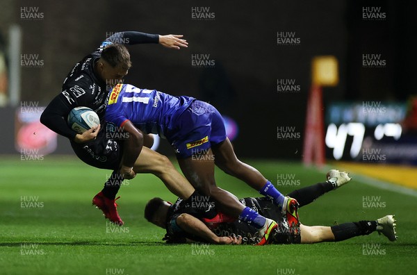 151021 - Dragons v DHL Stormers - United Rugby Championship - Jared Rosser of Dragons is tackled by Warrick Gelant of Stormers