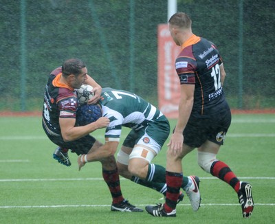 200816 - Dragons v Ealing Trailfinders - Ystrad MynachDragon scrum half Charlie Davies is tackled 