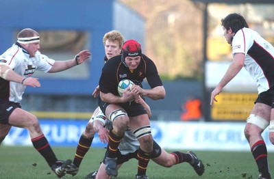 080105 - Newport Gwent Dragons v Edinburgh - Celtic League - Dragons Ian Gough is tackled by David Callam