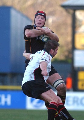 080105 - Newport Gwent Dragons v Edinburgh - Celtic League - Dragons Ian Gough is tackled by Andrew Kelly