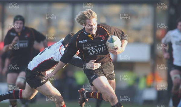 080105 - Newport Gwent Dragons v Edinburgh - Celtic League - Dragons Percy Mongomery is pulled down short of the line by Derrick Lee