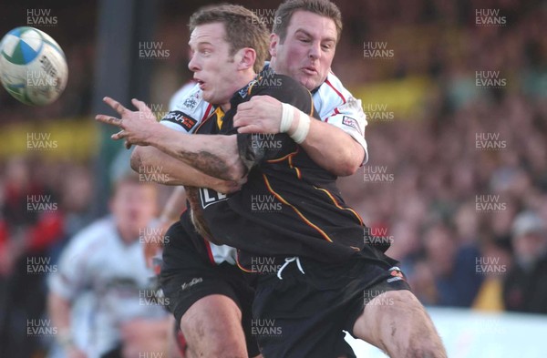 080105 - Newport Gwent Dragons v Edinburgh - Celtic League - Dragon's Kevin Morgan is tackled by Brendan Laney