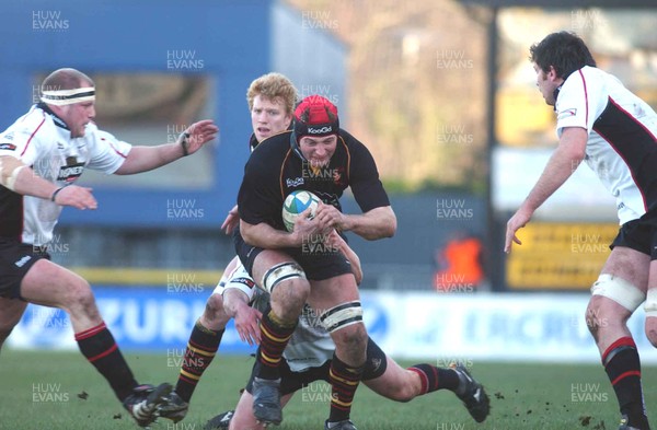 080105 - Newport Gwent Dragons v Edinburgh - Celtic League - Dragons Ian Gough is tackled by David Callam