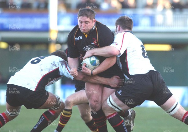 080105 - Newport Gwent Dragons v Edinburgh - Celtic League - Dragon's Rhys Thomas is tackled by David Callam and Alasdair Strokosch