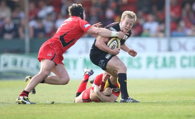 18.04.10 ... Newport Gwent Dragons v Edinburgh - Magners League -  Dragons' Ashley Smith is tackled  