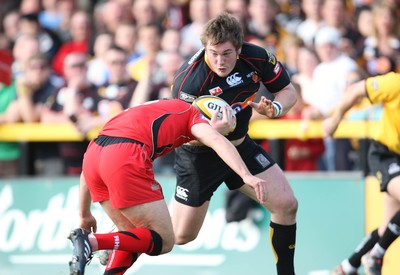 18.04.10 ... Newport Gwent Dragons v Edinburgh - Magners League -  Dragons' Hugh Gustafson takse on Edinburgh's Mike Blair 