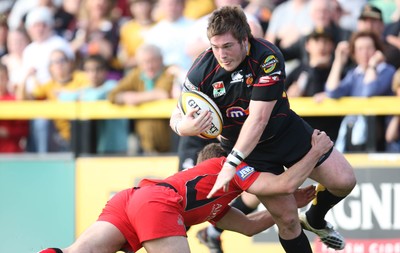 18.04.10 ... Newport Gwent Dragons v Edinburgh - Magners League -  Dragons' Hugh Gustafson takse on Edinburgh's Mike Blair 