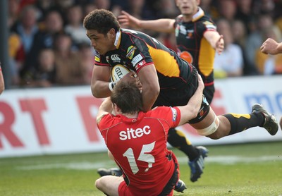 18.04.10 ... Newport Gwent Dragons v Edinburgh - Magners League -  Dragons' Toby Faletau is tackled by Edinburgh's Jim Thompson 