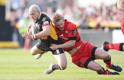 18.04.10 ... Newport Gwent Dragons v Edinburgh - Magners League -  Dragons' Richard Fussell is tackled by Edinburgh's Ben Cairns 