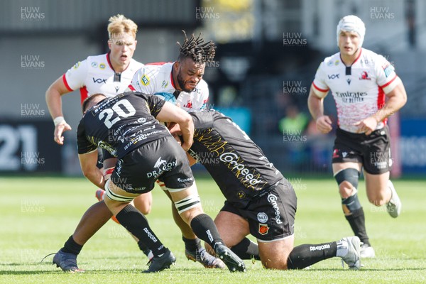 210522 - Dragons v Emirates Lions - United Rugby Championship - Vincent Tshituka of Emirates Lions is tackled by Lennon Greggains and Chris Coleman of Dragons