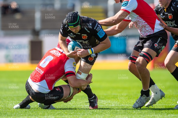 210522 - Dragons v Emirates Lions - United Rugby Championship - Joe Maksymiw of Dragons is tackled by Francke Horn of Emirates Lions