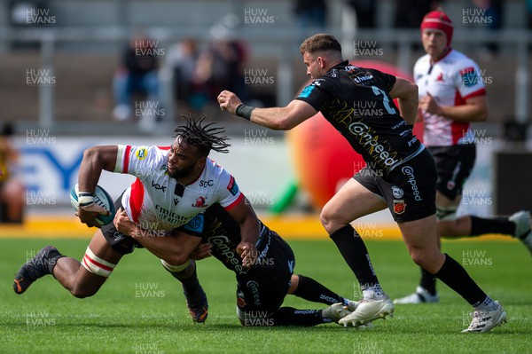 210522 - Dragons v Emirates Lions - United Rugby Championship - Vincent Tshituka of Emirates Lions is tackled by Ollie Griffiths of Dragons