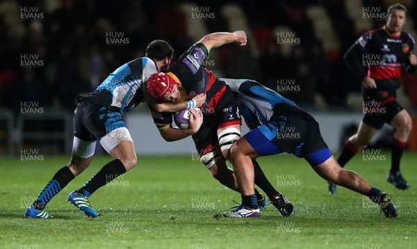 081217 - Dragons v Enisei-STM - European Rugby Challenge Cup - Joe Davies of Dragons is tackled by Vitalii Orlov and Uldis Saulite of Enisei-STM