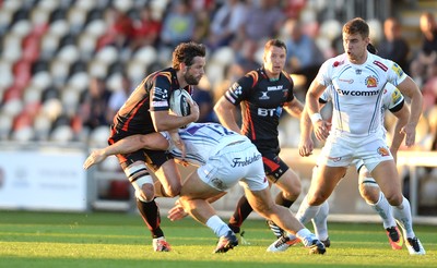 260816 - Newport-Gwent Dragons v Exeter Chiefs - Preseason Friendly -Nick Macleod of Dragons is tackled by Sam Hill of Exeter