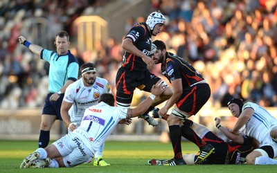 260816 - Newport-Gwent Dragons v Exeter Chiefs - Preseason Friendly -Oli Griffiths of Dragons is tackled by Ben Moon of Exeter