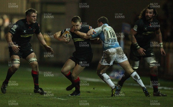 150213 - Newport Gwent Dragons v Glasgow, RaboDirect PRO12 - Dragons Tom Prydie  is tackled by Glasgow's Duncan Weir