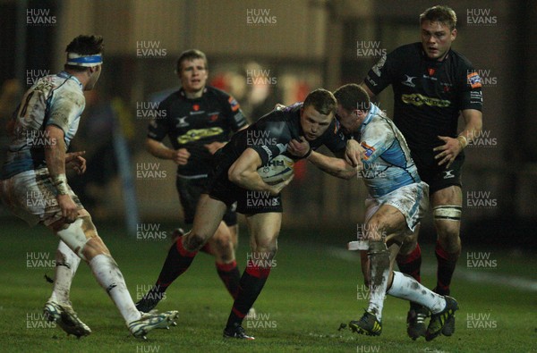 150213 - Newport Gwent Dragons v Glasgow, RaboDirect PRO12 - Dragons Tom Prydie  is tackled by Glasgow's Duncan Weir