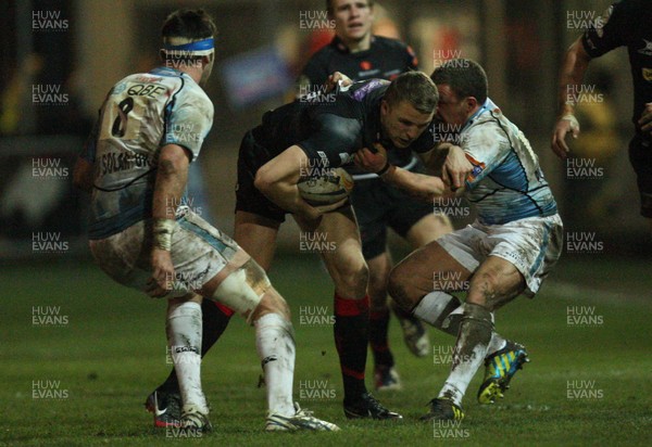 150213 - Newport Gwent Dragons v Glasgow, RaboDirect PRO12 - Dragons Tom Prydie  is tackled by Glasgow's Duncan Weir