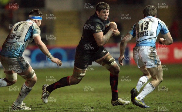 150213 - Newport Gwent Dragons v Glasgow, RaboDirect PRO12 - Dragons Ieuan Jones takes on Glasgow's Ryan Wilson and Glasgow's Mark Bennett    