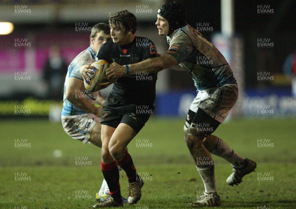 150213 - Newport Gwent Dragons v Glasgow, RaboDirect PRO12 - Dragons Steffan Jones is tackled by Glasgow's Tim Swinson   