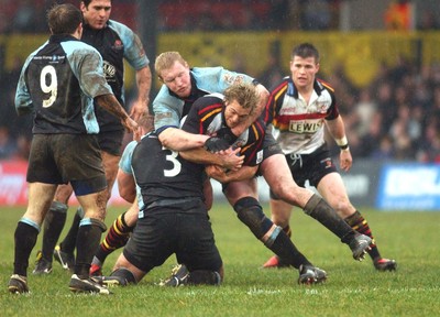 220105 - Newport Gwent Dragons v Glasgow - Celtic League - Dragons Percy Montgomery is tackled by Cameron Mather and Andrew Kelly