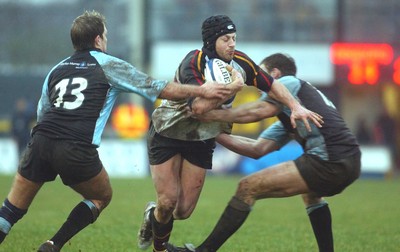 220105 - Newport Gwent Dragons v Glasgow - Celtic League - Dragons Haldane Luscombe is tackled by Andy Craig and Andrew Henderson