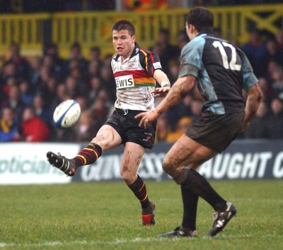 220105 - Newport Gwent Dragons v Glasgow - Celtic League - Dragons Ceri Sweeney kicks past Andrew Henderson