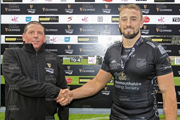 261019 - Dragons v Glasgow, Guinness Pro 14 - Ollie Griffiths of Dragons (right) receives his Man of The Match Medal at the end of the match