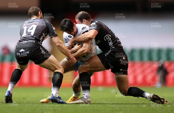 210321 - Dragons v Glasgow Warriors - Guinness PRO14 - Rufus McLean of Glasgow is tackled by Jamie Roberts of Dragons
