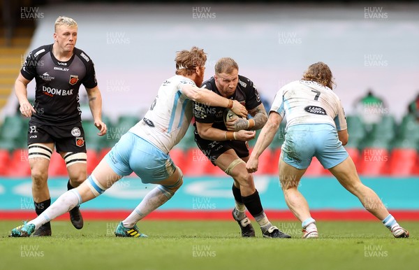 210321 - Dragons v Glasgow Warriors - Guinness PRO14 - Ross Moriarty of Dragons is tackled by Rob Harley and Thomas Gordon of Glasgow