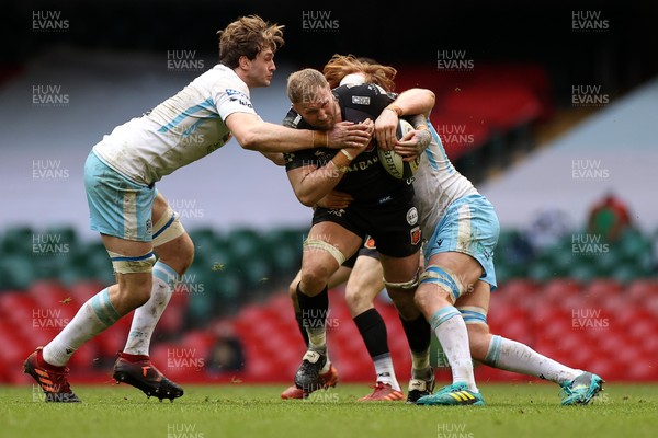 210321 - Dragons v Glasgow Warriors - Guinness PRO14 - Ross Moriarty of Dragons is tackled by Richie Gray and Rob Harley of Glasgow