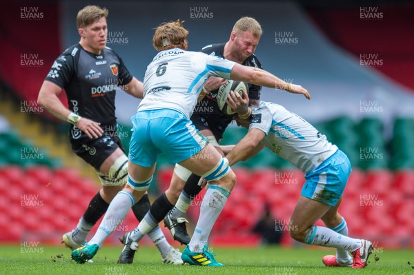 210321 - Dragons v Glasgow Warriors - Guinness PRO14 - Ross Moriarty of Dragons is tackled by Ross Thompson of Glasgow Warriors and Rob Harley of Glasgow Warriors