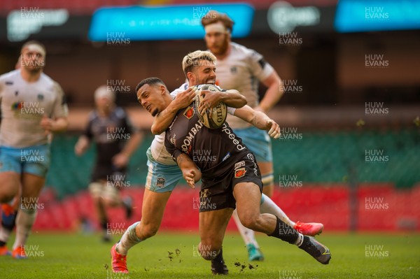 210321 - Dragons v Glasgow Warriors - Guinness PRO14 - Ashton Hewitt of Dragons is tackled by Adam Hastings of Glasgow Warriors