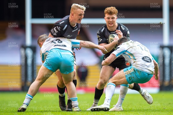 210321 - Dragons v Glasgow Warriors - Guinness PRO14 - Aneurin Owen of Dragons is tackled by Robbie Ferguson of Glasgow Warriors