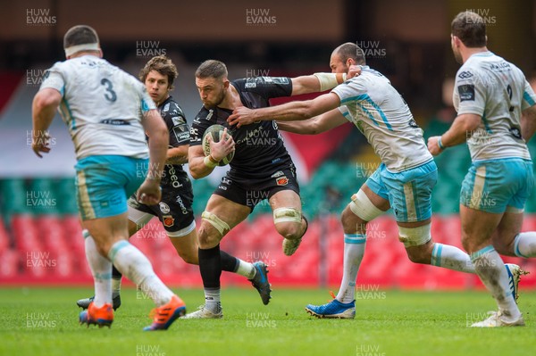 210321 - Dragons v Glasgow Warriors - Guinness PRO14 - Harrison Keddie of Dragons holds off the tackle of Kiran McDonald of Glasgow Warriors