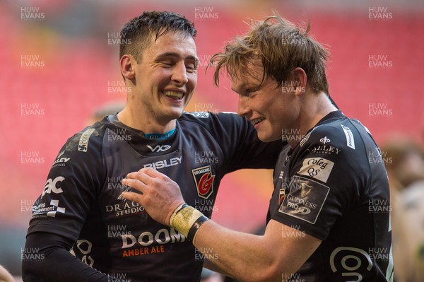 210321 - Dragons v Glasgow Warriors - Guinness PRO14 - Sam Davies of Dragons and Nick Tompkins of Dragons celebrate at the final whistle