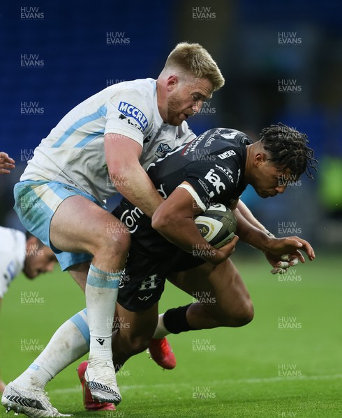 290521 - Dragons v Glasgow Warriors, Guinness PRO14 Rainbow Cup - Rio Dyer of Dragons is held by Kyle Steyn of Glasgow Warriors