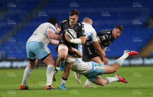 290521 - Dragons v Glasgow Warriors, Guinness PRO14 Rainbow Cup - Taine Basham of Dragons looks to get past Ross Thompson of Glasgow Warriors