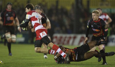 04.11.10..Newport Gwent Dragons v Gloucester, LV= Cup - Gloucesters Jonny May is tackled by Aled Brew 