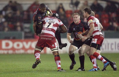 04.11.10..Newport Gwent Dragons v Gloucester, LV= Cup - Dragons Aled Brew is tackled by Akapusi Qera 