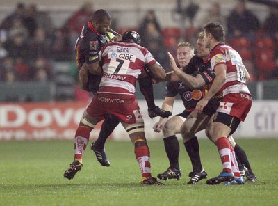 04.11.10..Newport Gwent Dragons v Gloucester, LV= Cup - Dragons Aled Brew is tackled by Akapusi Qera 