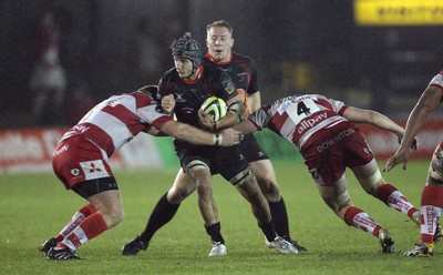 04.11.10..Newport Gwent Dragons v Gloucester, LV= Cup - Dragons Robin Sowden-Taylor takes on on Dan Williams and Pierre Capdevielle 