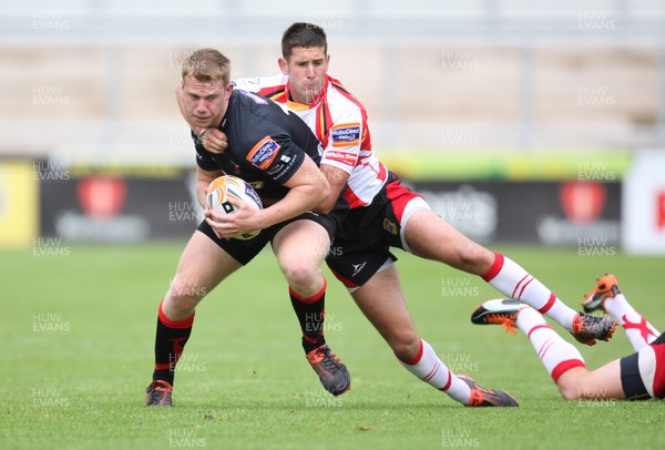 040812 - Newport Gwent Dragons v Gwent Select XV, Pre-season Friendly - Dragons Jack Dixon is tackled by Gwent's Richard Powell 