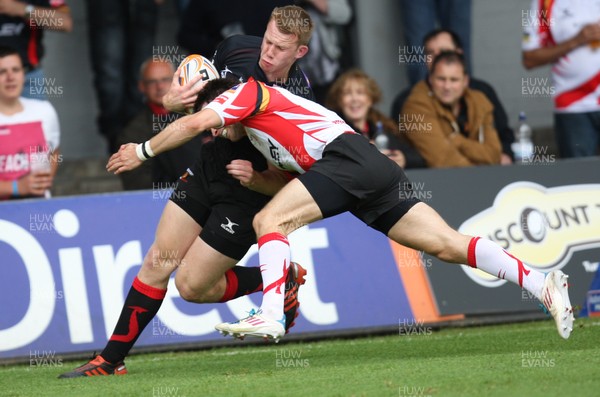 040812 - Newport Gwent Dragons v Gwent Select XV, Pre-season Friendly - Dragons Jack Dixon is tackled by Gwent's Elliot Frewen     