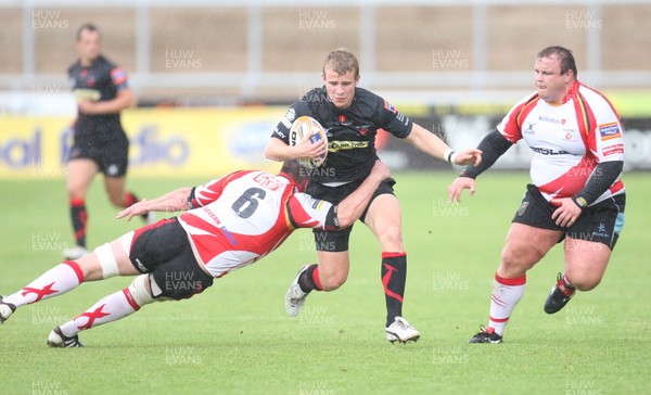 040812 - Newport Gwent Dragons v Gwent Select XV, Pre-season Friendly - Dragons Jonathan Evans takes on Gwent's Phil Sargent     