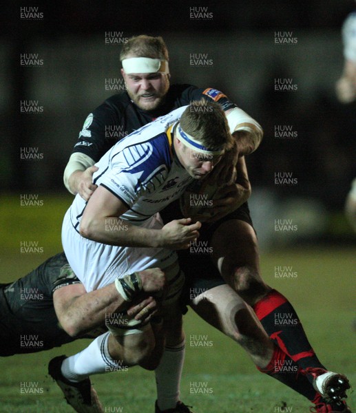 010313 - Newport Gwent Dragons v Leinster, RaboDirect PRO12 - Leinster's Jordi Murphy is tackled by Dragons' Ian Nimmo and Dragons' Aaron Coundley