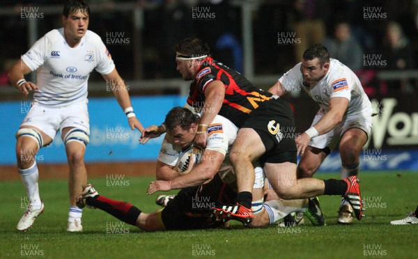 011113 - Newport Gwent Dragons v Leinster, RaboDirect PRO12 - Leinster's Rhys Ruddock is tackled by Dragons Dan Way and Dragons Sam Parry