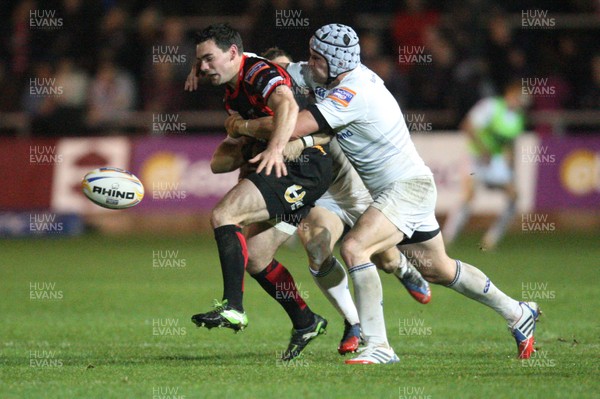 011113 - Newport Gwent Dragons v Leinster, RaboDirect PRO12 - Dragons Adam Hughes is tackled by Leinster's Jimmy Gopperth and Shane Jennings