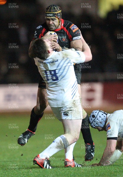 011113 - Newport Gwent Dragons v Leinster, RaboDirect PRO12 - Dragons Netani Talei charges into Leinster's Tadhg Furlong as Leinster's Shane Jennings tackles