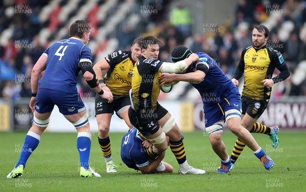 121123 - Dragons v Leinster - United Rugby Championship - Taine Basham of Dragons is tackled by Dan Sheehan of Leinster 